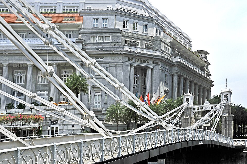 The white stays of Cavenagh Bridge with the colonnaded Fullerton behind