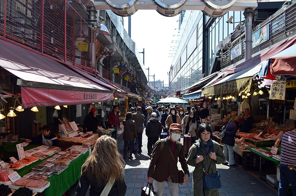 Ameya-Yokochō beside the tracks, stalls and shoppers filling the lane